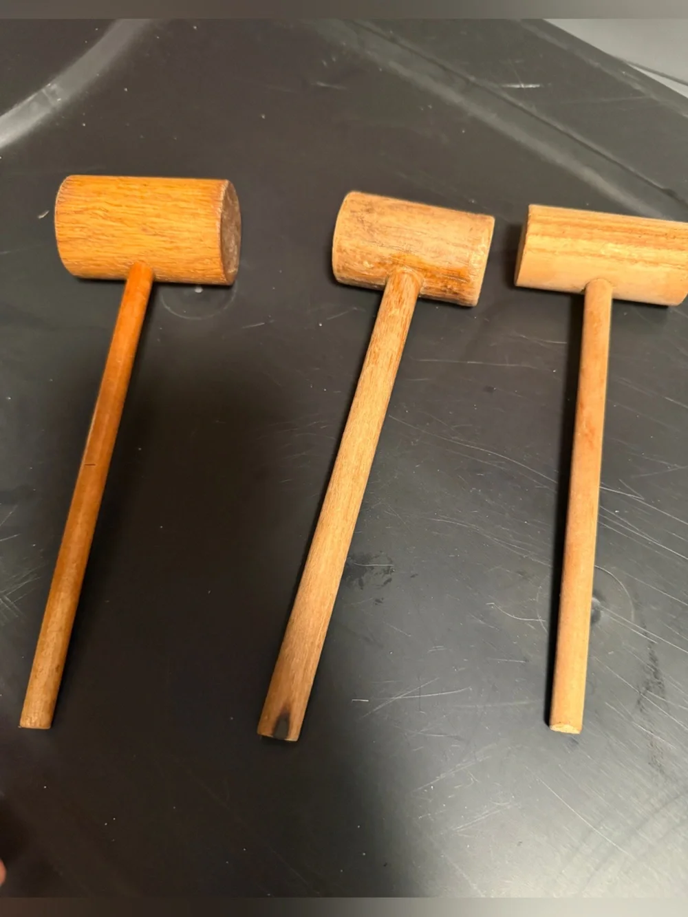traditional wooden mallets, commonly used for tasks like cracking shellfish,